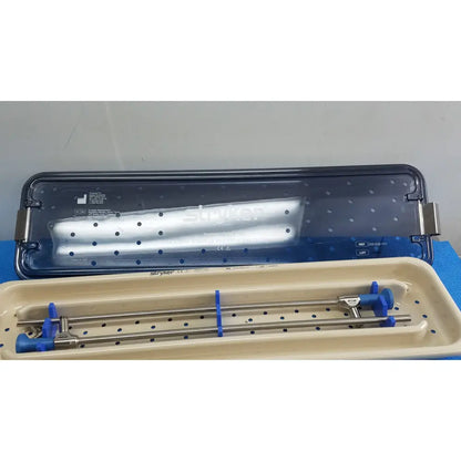 Stryker ideal eyes 10mm autoclavable surgical instrument tray with metallic rods and blue plastic handles for precise use