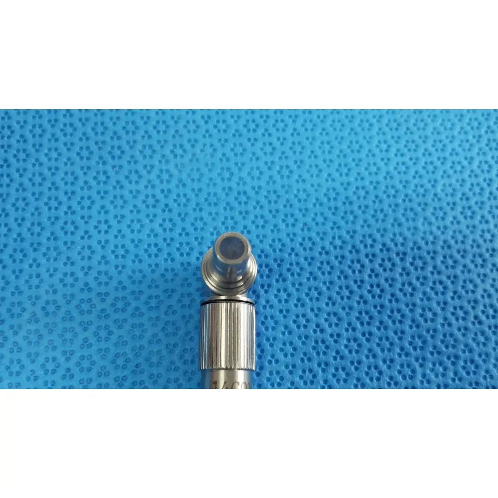 Silver metallic ideal eyes 10mm surgical instrument tip with threaded ribbed body and rounded hollowed end for autoclavable use