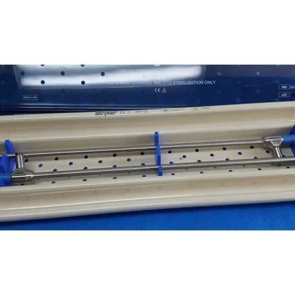Stainless steel surgical instrument with blue plastic handles branded Stryker ideal eyes 10mm autoclavable scope and trey