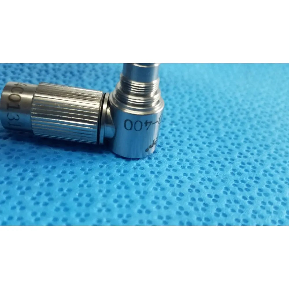 Silver metallic ideal eyes 10mm surgical instrument with knurled grip and engraved markings for precise use