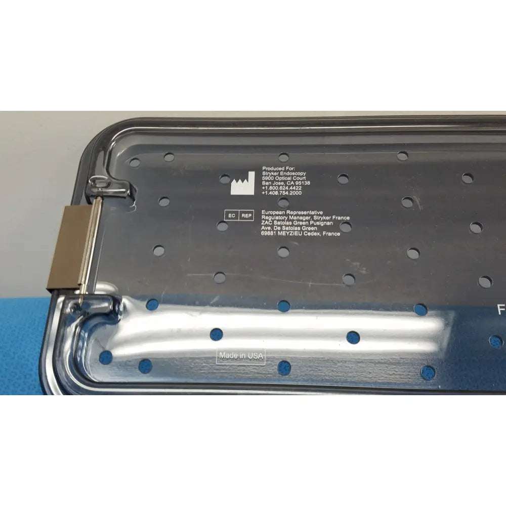 Silver metallic tray with hinged lid and perforated surface engraved for stryker endoscopy ideal eyes 10mm product