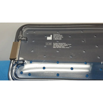 Silver metallic tray with hinged lid and perforated surface engraved for stryker endoscopy ideal eyes 10mm product