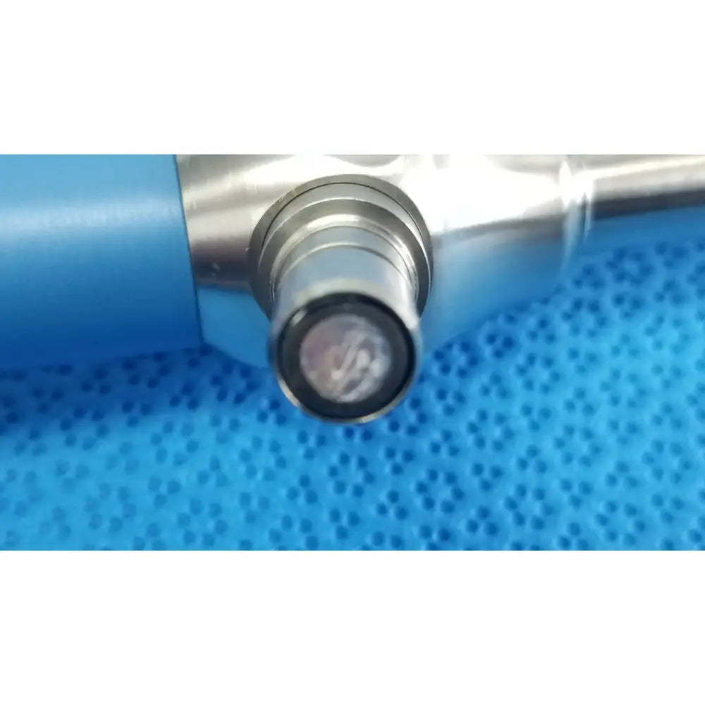 Silver surgical instrument with blue handle and dark-tinted circular lens tip ideal eyes 10mm autoclavable