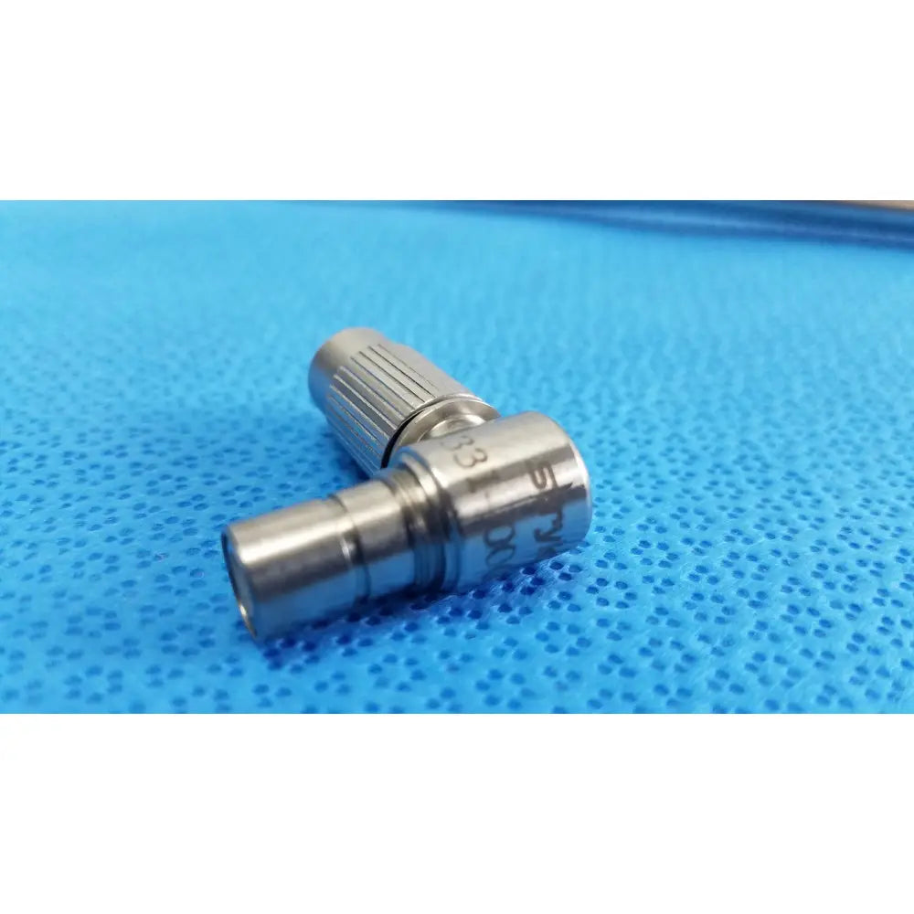 Silver metallic medical-grade connector with threaded ends and engraved markings for stryker ideal eyes 10mm scope