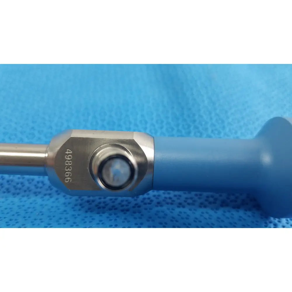 Blue-handled ideal eyes 10mm surgical instrument with metallic hexagonal joint and engraved serial number 498366