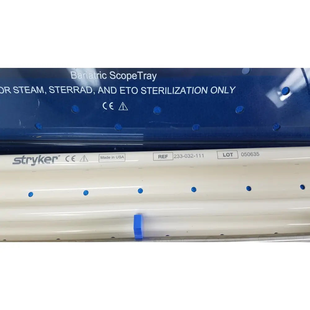 White stryker bariatric scopetray with blue circular indentations and clip for ideal eyes 10mm autoclavable use