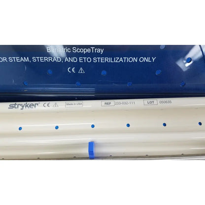 White stryker bariatric scopetray with blue circular indentations and clip for ideal eyes 10mm autoclavable use