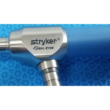 Silver metallic ideal eyes 10mm surgical instrument with blue handle autoclavable by Stryker for precision use