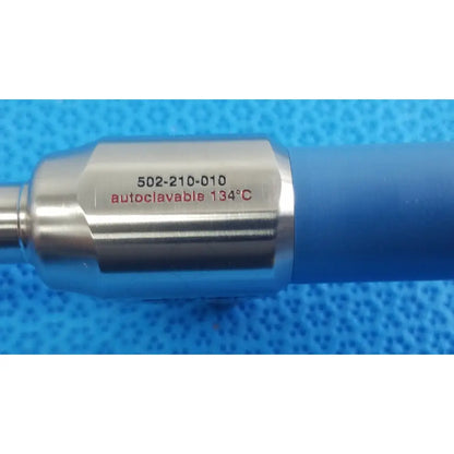 Silver metallic surgical instrument with blue grip ideal eyes 10mm model 502-210-010 autoclavable at 134°c