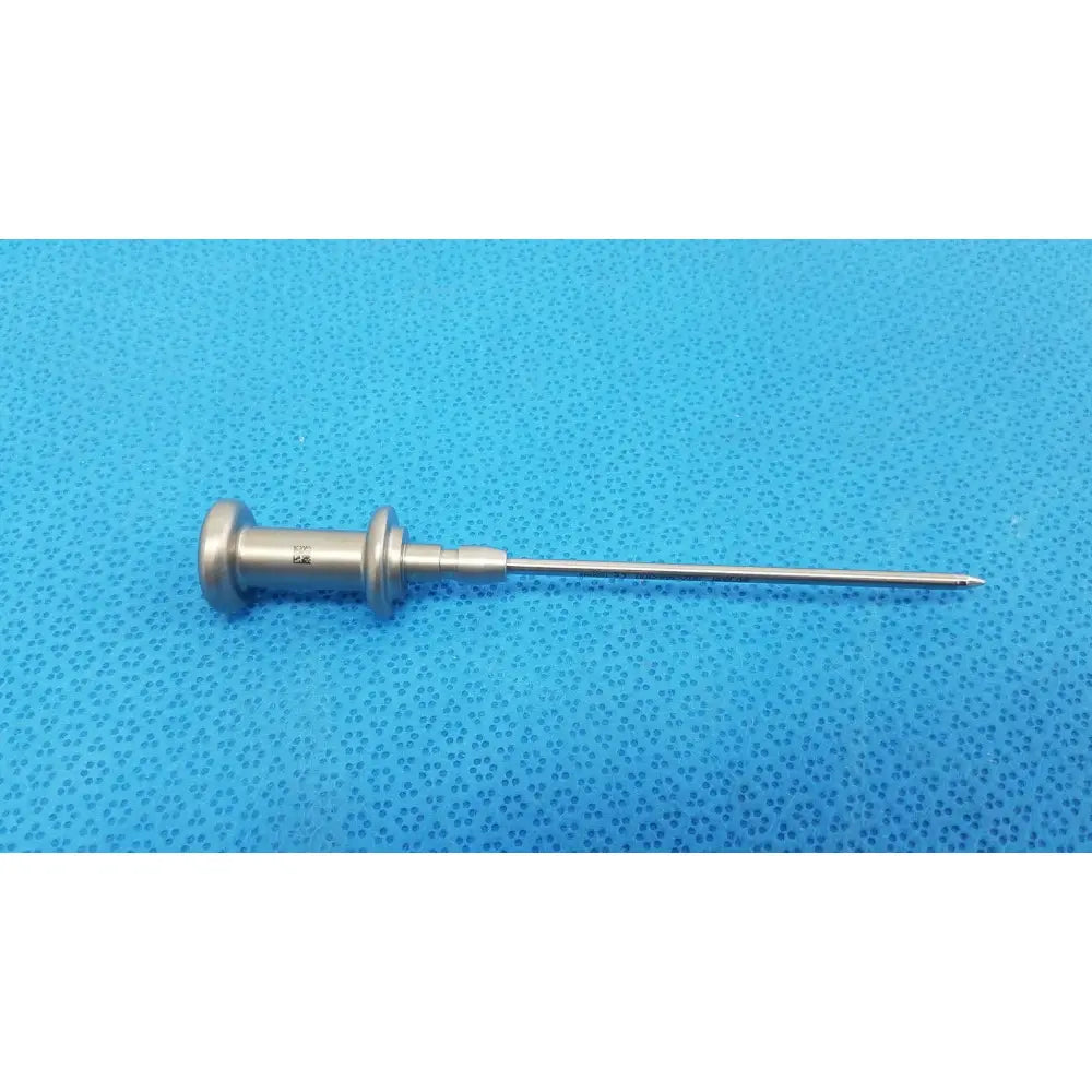 Silver stainless steel trocar surgical orthopedic instrument with slender pointed tip and textured handle for precision use