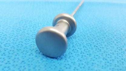 Silver metallic trocar surgical orthopedic instrument with rounded textured handle and slender shaft by stryker