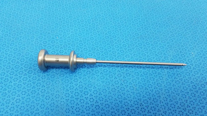 Silver stainless steel trocar surgical orthopedic instrument with slender pointed tip and textured handle for precision use