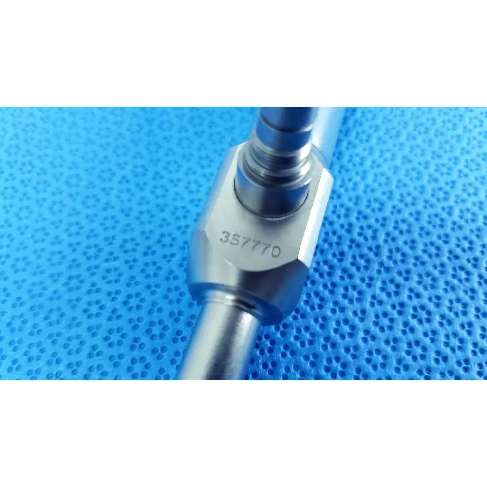 Silver metallic 10mm 0° autoclavable endoscope with hexagonal flange and serial number 357770 for reuse medical use
