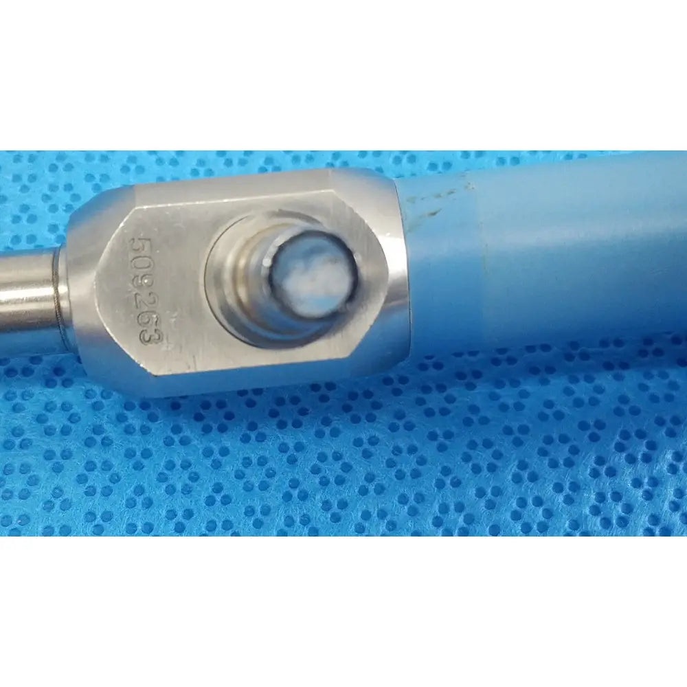 Silver metallic handle of stryker 10mm 0° autoclavable endoscope with blue sleeve and serial number 509263