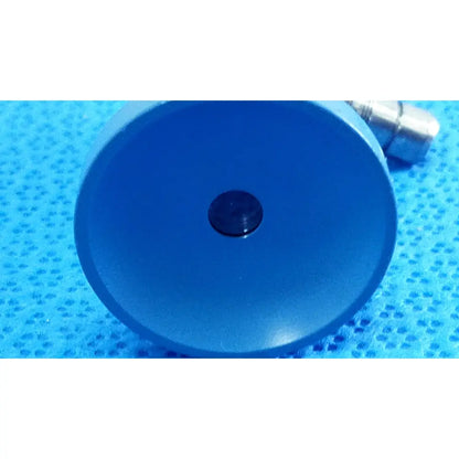 Blue circular plastic component with central black button for stryker ideal eyes 5mm autoclavable endoscope