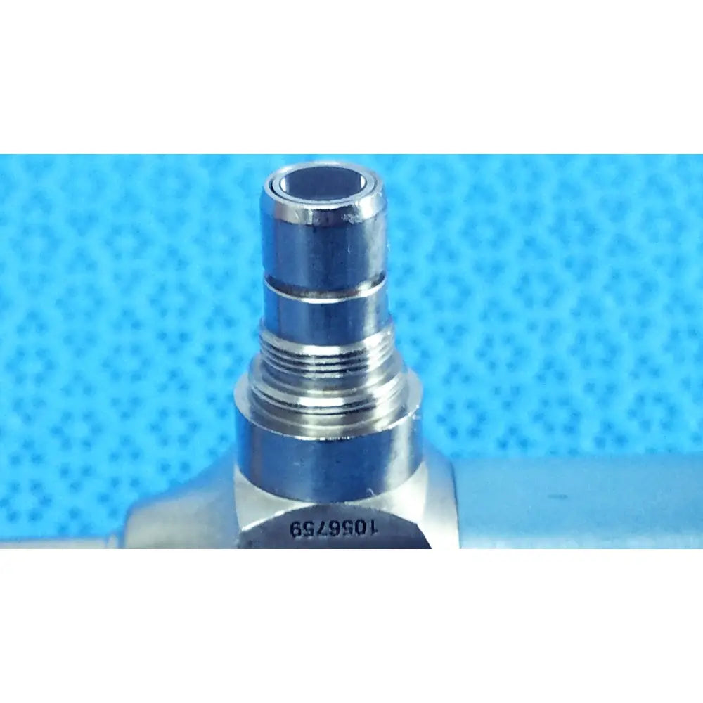 Silver metallic threaded valve connector with hexagonal base and engraved serial number on stryker ideal eyes 5mm endoscope