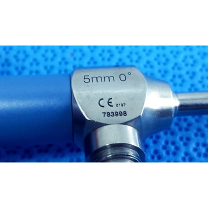 Silver metallic autoclavable endoscope with blue handle marked 5mm 0 degrees ce ideal eyes 5mm by stryker