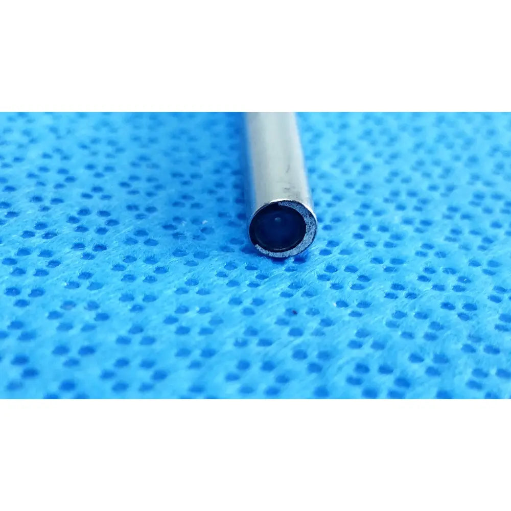 Silver cylindrical ideal eyes 5mm autoclavable endoscope with dark circular opening on blue textured surface