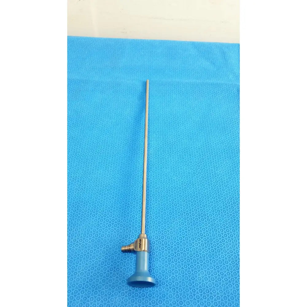 Silver surgical ideal eyes 5mm endoscope with blue handle and brass-colored joint for autoclavable use