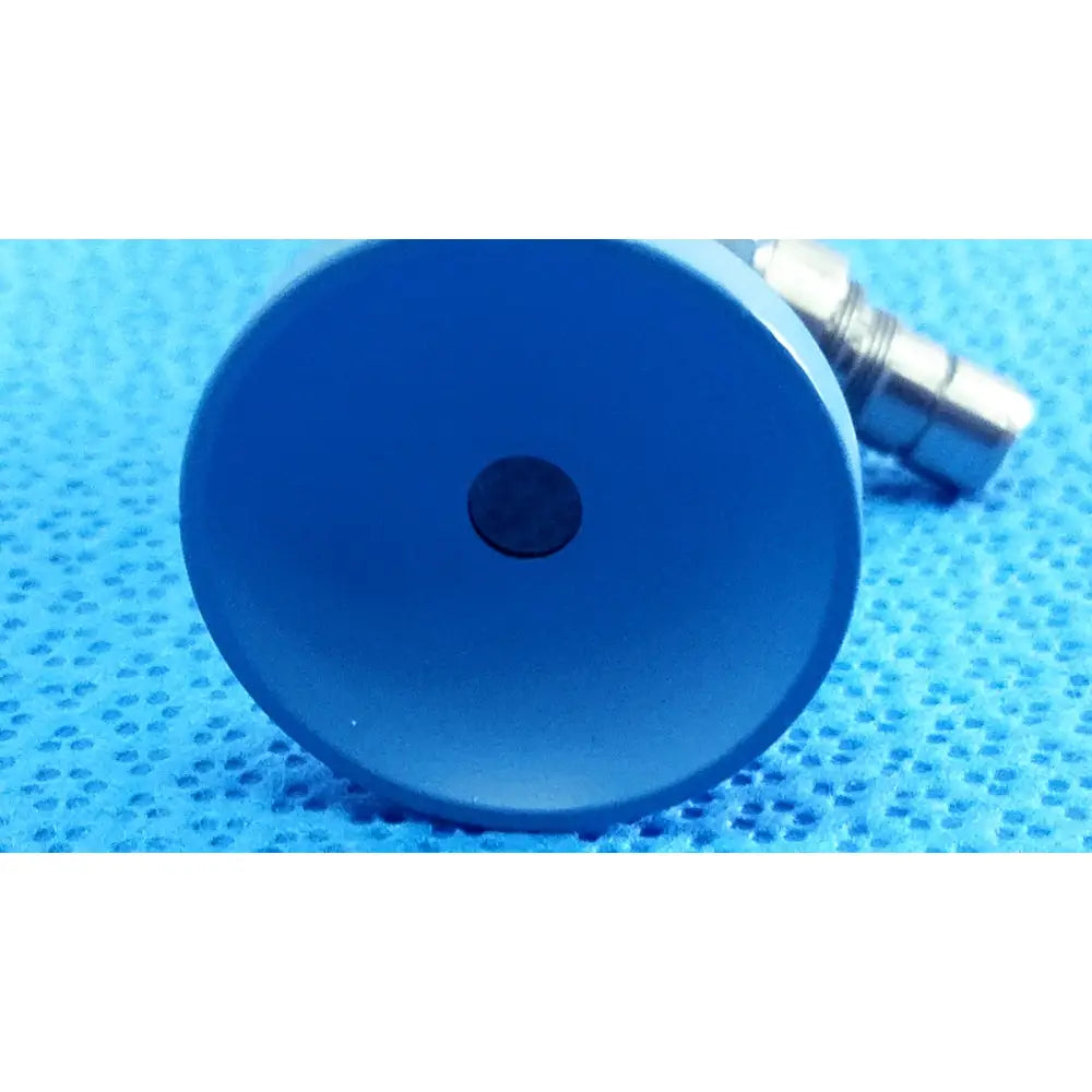 Blue circular plastic component with central black dot of stryker ideal eyes 5mm autoclavable endoscope back side