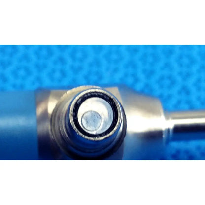 Silver-colored metallic connector with circular threaded end of stryker ideal eyes 5mm autoclavable endoscope