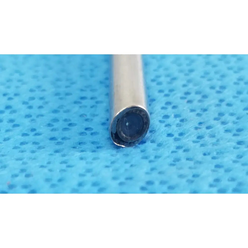 A slender metallic cylindrical stryker ideal eyes 5mm 30° autoclavable endoscope with a dark lens tip