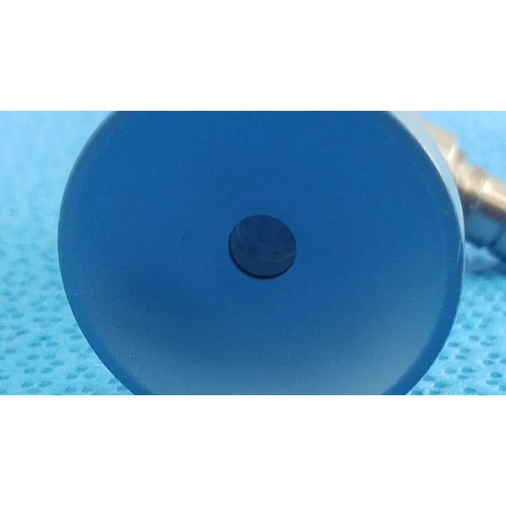 Blue circular plastic cap with central black button on the back side of stryker ideal eyes 5mm autoclavable endoscope