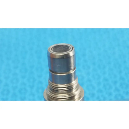 Silver metallic threaded connector with circular black top on stryker ideal eyes 5mm 30° autoclavable endoscope back side
