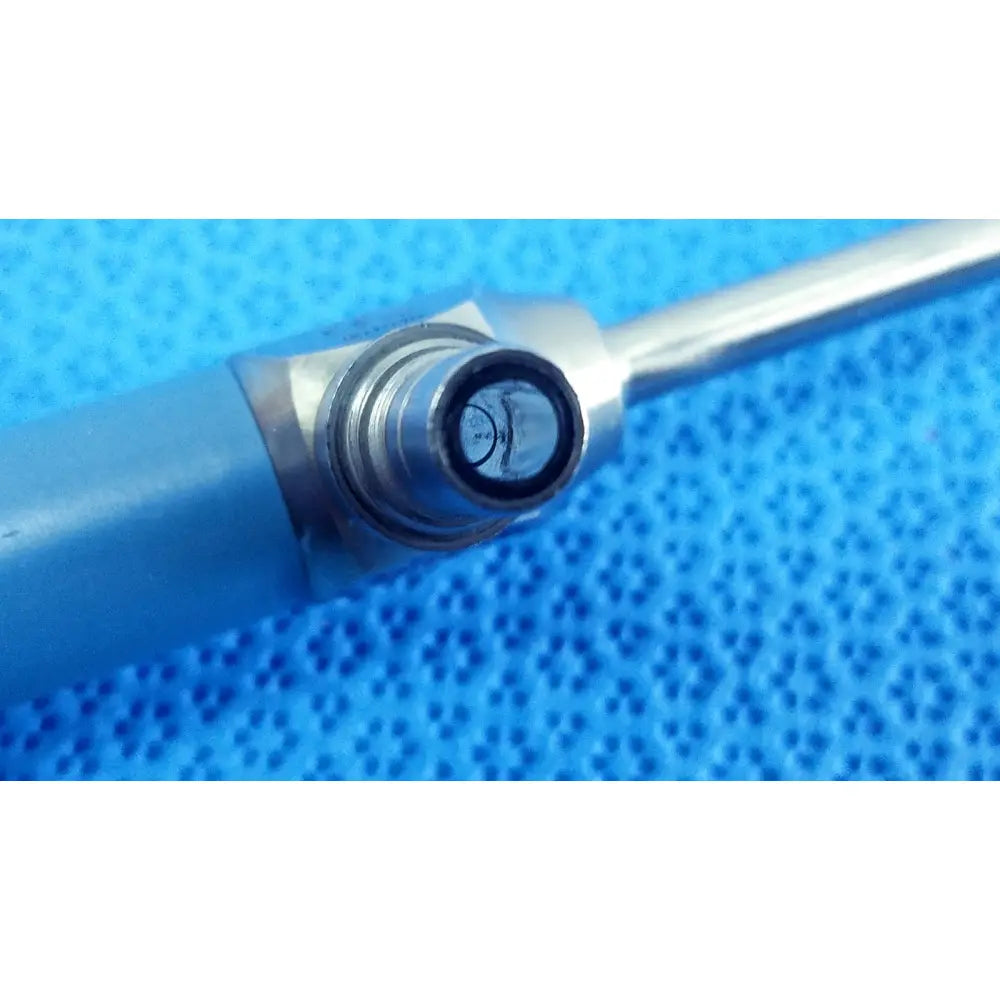 Silver-colored cylindrical surgical instrument with threaded connection ideal eyes 5mm autoclavable endoscope