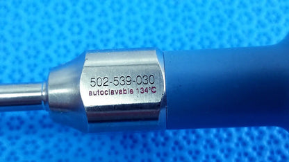 Blue-handled stryker ideal eyes 5mm surgical instrument with metallic hexagonal shaft engraved with model and autoclave details