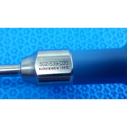 Blue-handled stryker ideal eyes 5mm surgical instrument with metallic hexagonal shaft engraved with model and autoclave details