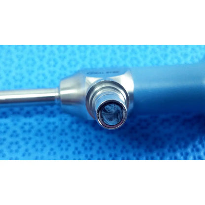 Silver surgical instrument with metallic shaft and blue handle featuring engraved brand name for ideal eyes 5mm endoscope