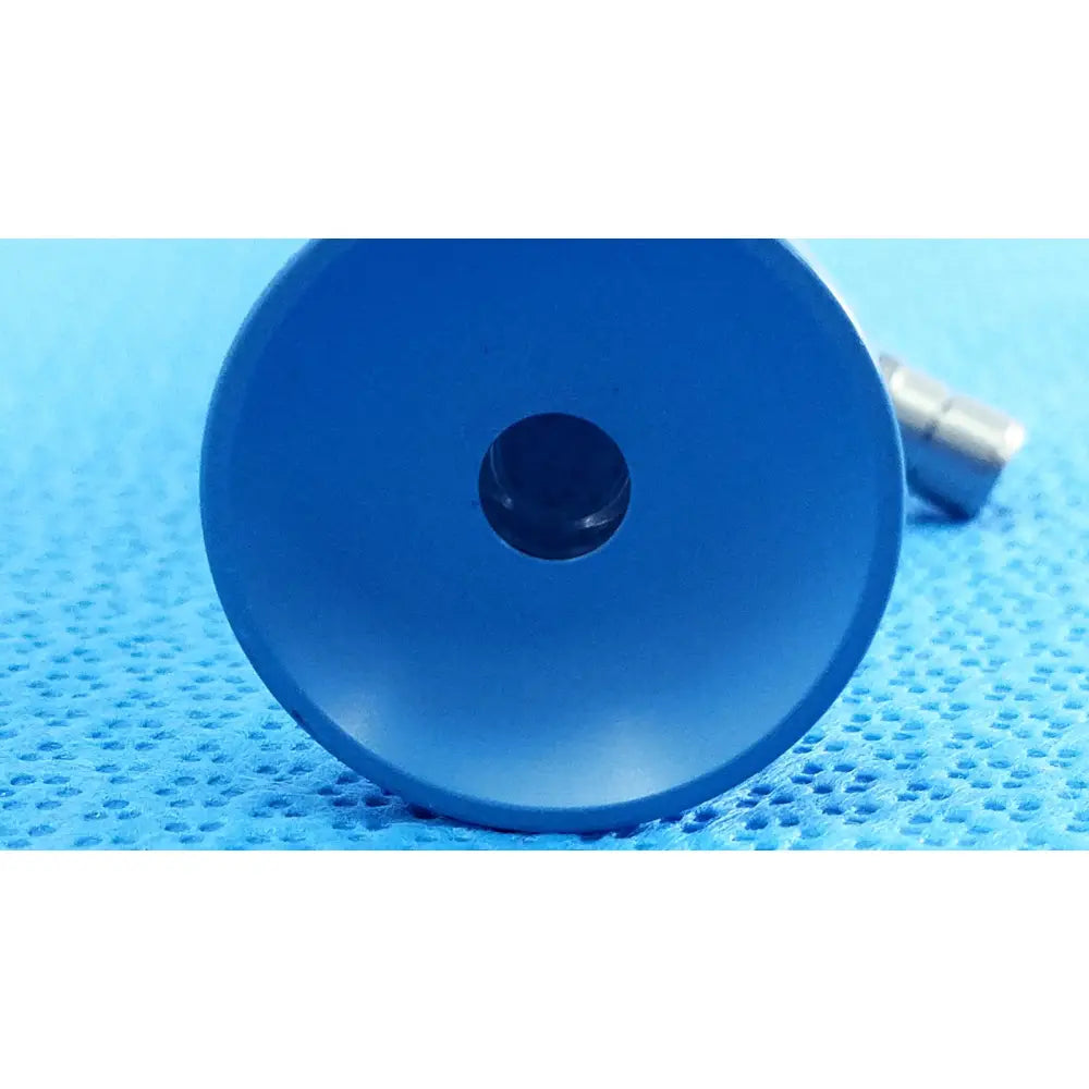 Blue circular plastic component with central black hole of stryker ideal eyes 10mm autoclavable endoscope back side