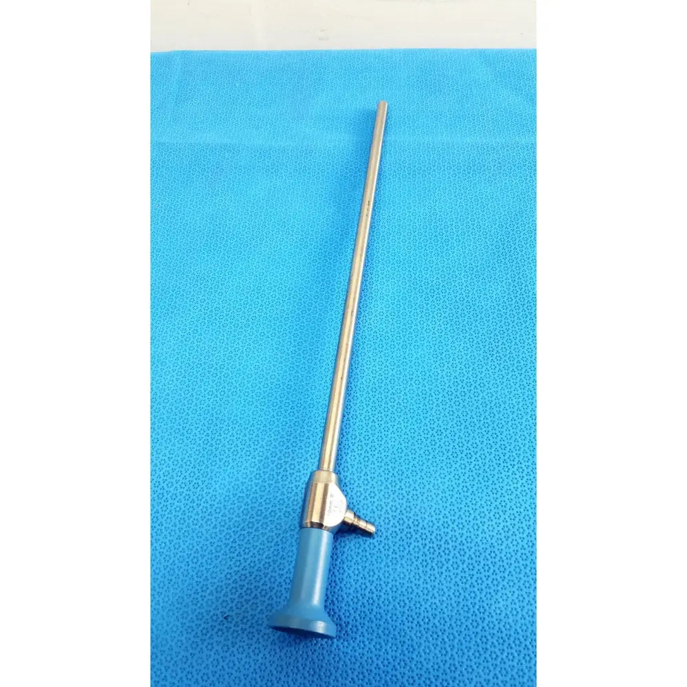 A slender metallic stryker ideal eyes 10mm autoclavable endoscope with blue handle and brass-colored joint