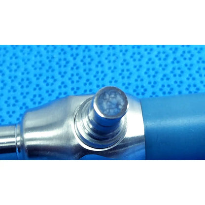 Silver-toned metal tip with textured surface on stryker ideal eyes 10mm 0 degree autoclavable endoscope