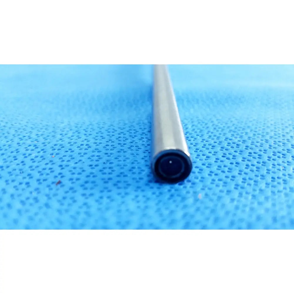 A sleek metallic cylindrical tube with a black end cap part of the stryker 502-859-010 ideal eyes 10mm endoscope