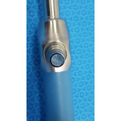Silver-toned metal syringe with translucent blue barrel and black rubber plunger tip for stryker ideal eyes 10mm endoscope