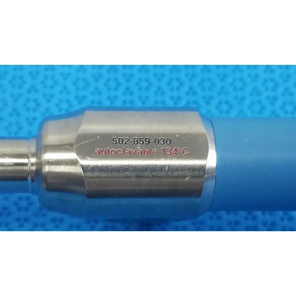 Silver metallic connector with serial number and autoclave marking attached to blue ideal eyes 10mm endoscope component