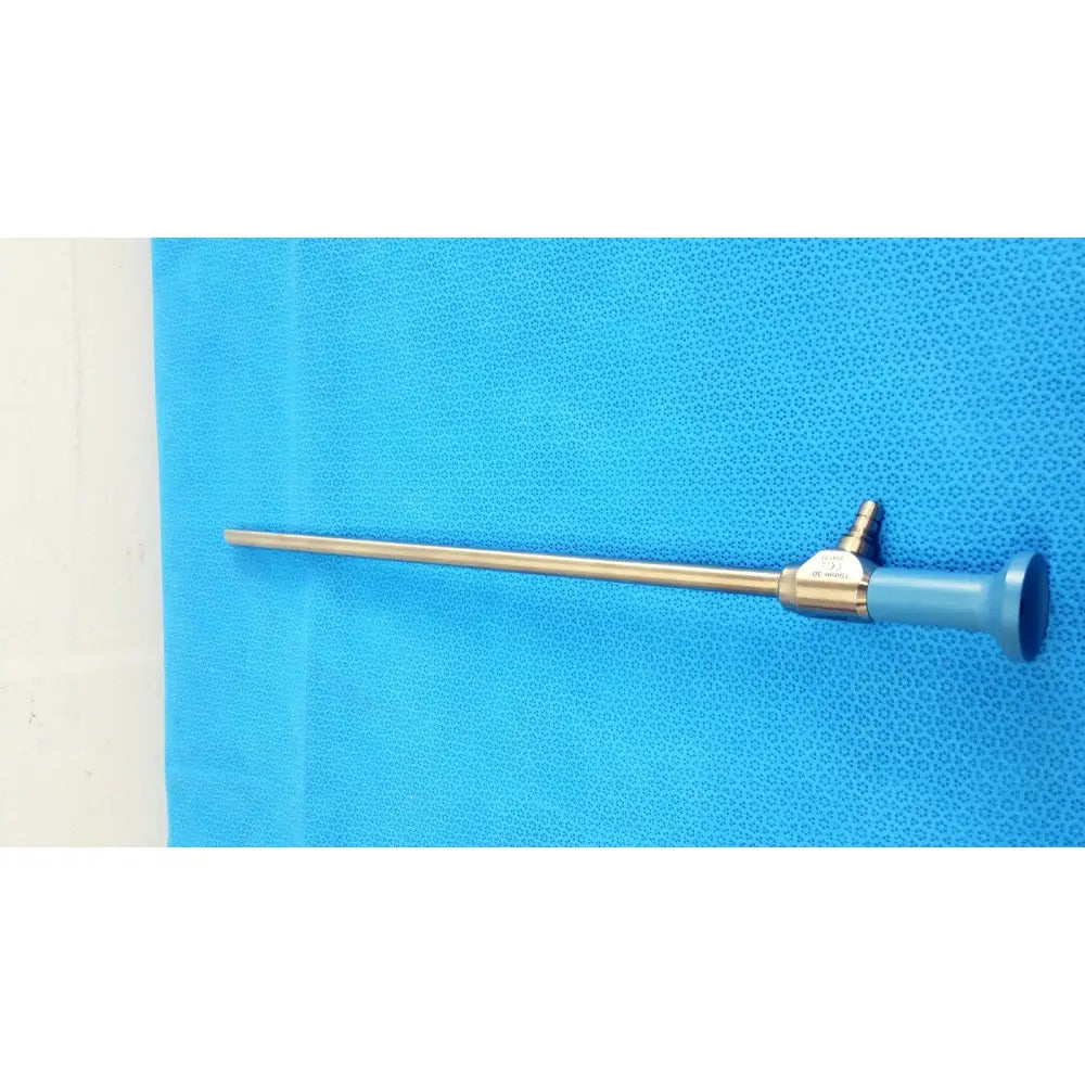 Metallic surgical endoscope with blue handle and slender gold-toned shaft stryker ideal eyes 10mm 30 degree autoclavable