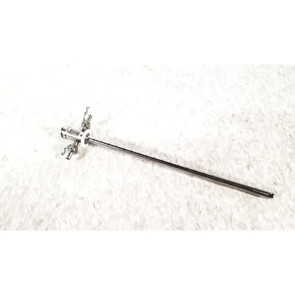 Silver stryker scope sheath 25fr instrument with long slender shaft and multiple adjustment knobs at handle end