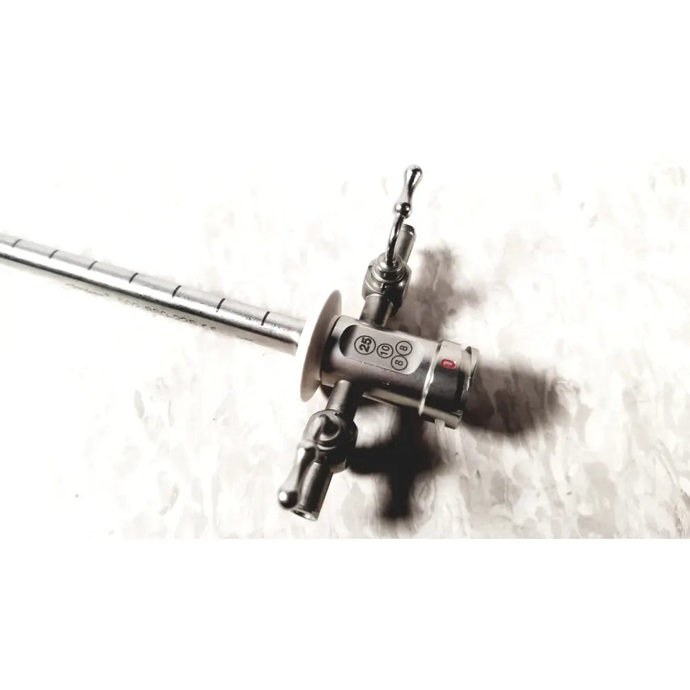 Stainless steel Stryker scope sheath 25fr instrument with long segmented shaft and control head featuring ports and red button