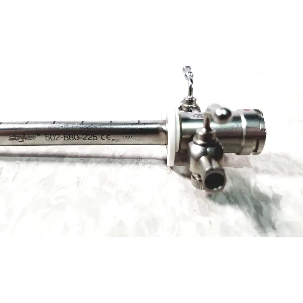 Stryker scope sheath 25fr instrument with metallic silver body engraved markings and control knobs visible on front side