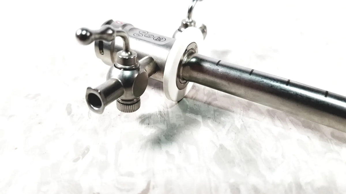 Stainless steel stryker scope sheath 25fr instrument with polished metallic finish and engraved markings on body