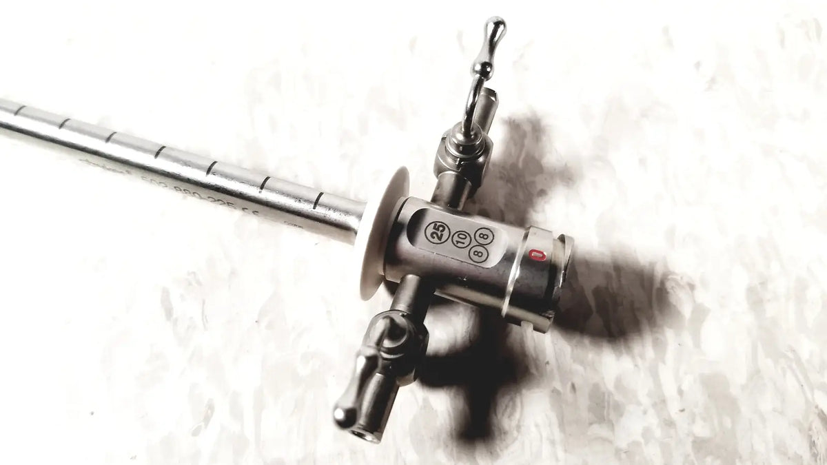 Stainless steel Stryker scope sheath 25fr instrument with long segmented shaft and control head featuring ports and red button