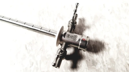 Stainless steel Stryker scope sheath 25fr instrument with long segmented shaft and control head featuring ports and red button