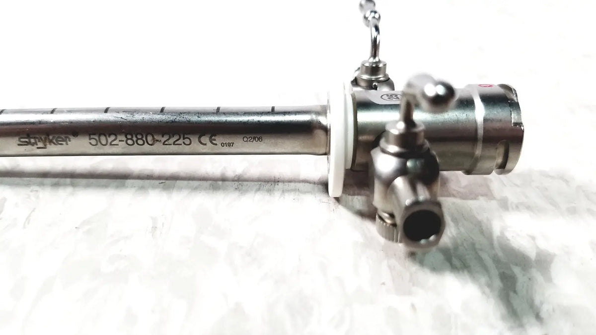 Stryker scope sheath 25fr instrument with metallic silver body engraved markings and control knobs visible on front side