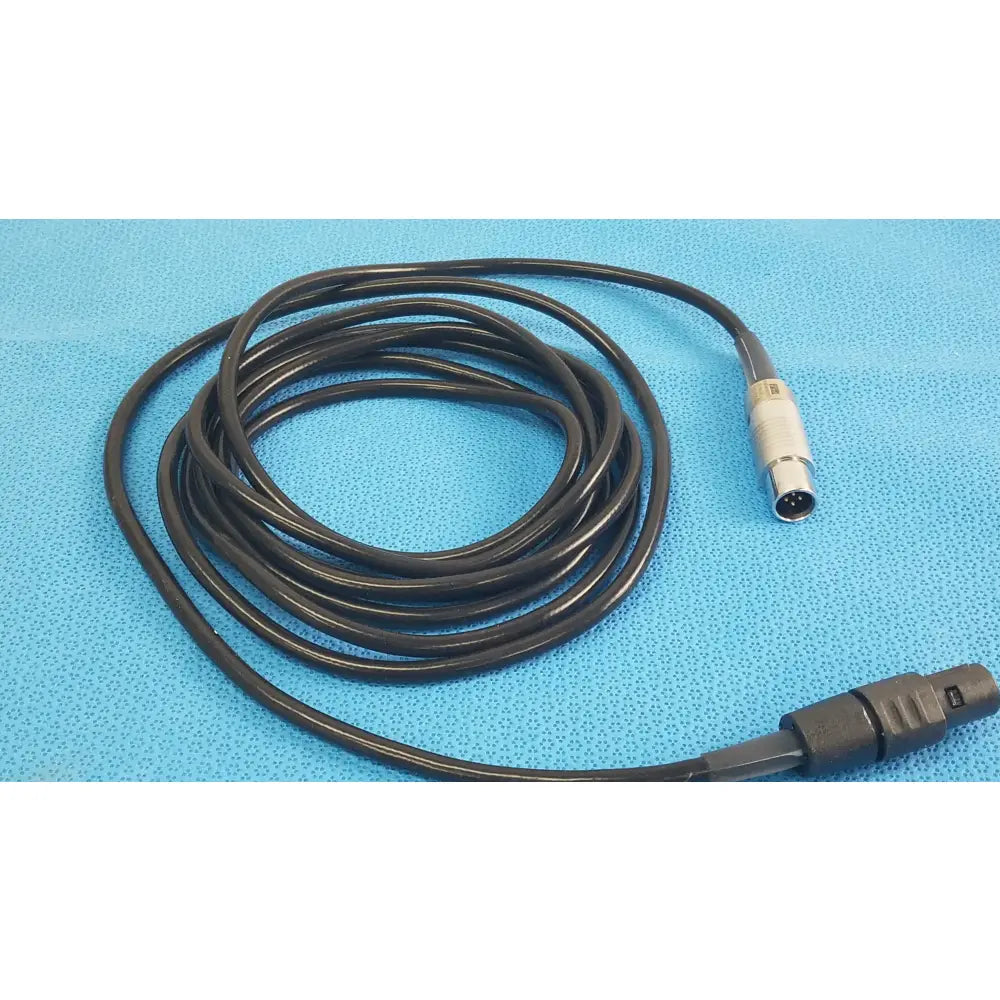 Black coiled scher handpiece cable with metallic connectors for reuse medical equipment in medical settings