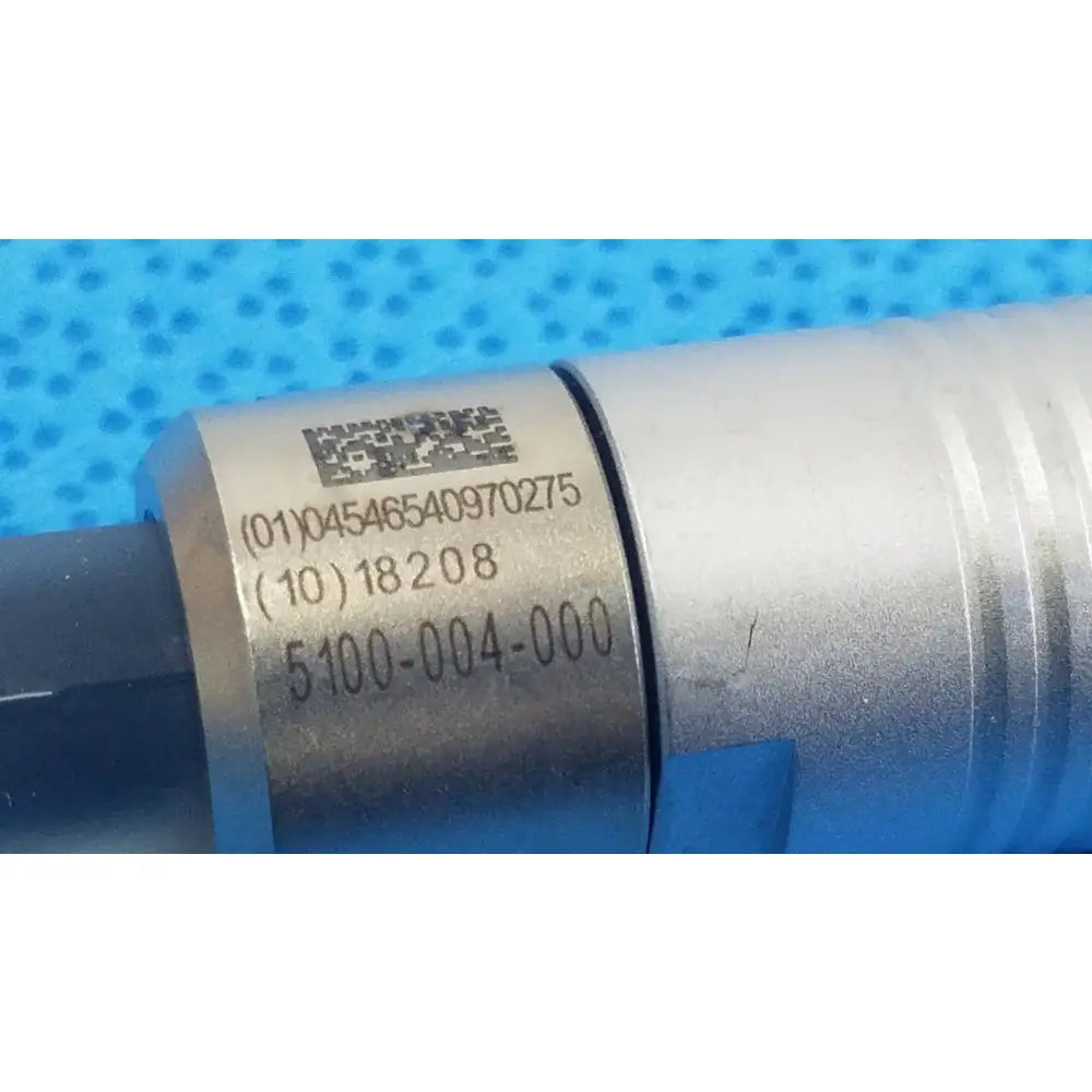 Silver metallic cylindrical scher handpiece cable with engraved serial numbers and qr code for reuse medical equipment