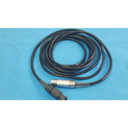 Black coiled scher handpiece cable with silver and black connector for reuse medical equipment in medical settings
