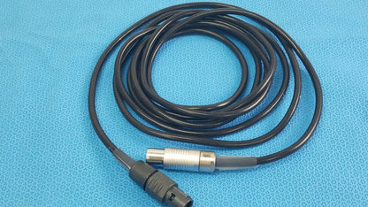 Black coiled scher handpiece cable with silver and black connector for reuse medical equipment in medical settings